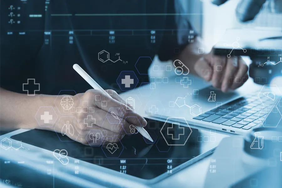 Close-up of a medical professional using a laptop and tablet, with illustrated medical symbols overlayed on the image, symbolizing health conditions treated by Dr. Lashea Davis Roland in Silver Spring.