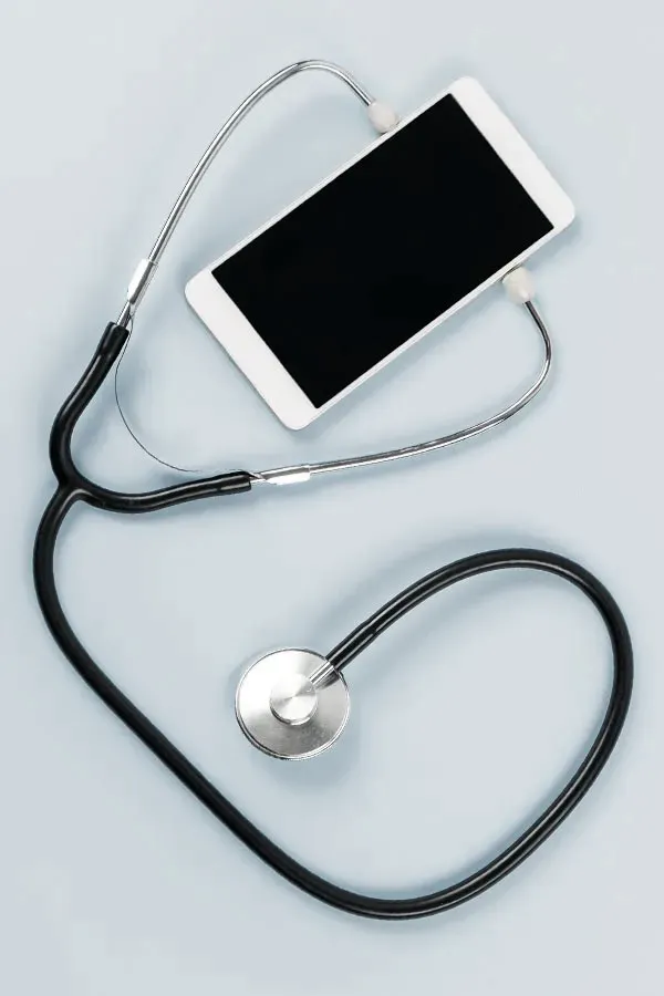 Telemedicine-Treatment A smartphone with a stethoscope attached to it, symbolizing Telemedicine treatment from Dr. Lashea Davis Roland in Silver Spring.