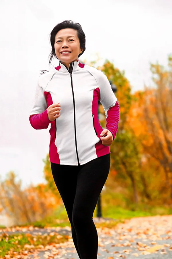 V-Tone-Vaginal-Rejuvenation-Treatment A middle-aged woman running confidently on a fall day after receiving V-Tone Vaginal Rejuvenation Treatment by Dr. Lashea Davis Roland in Silver Spring.